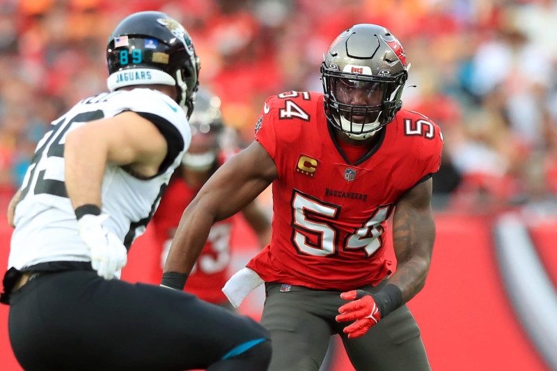 TAMPA, FL - DECEMBER 24: Tampa Bay Buccaneers Linebacker Lavonte David (54) eyes Jacksonville Jaguars Quarterback Trevor Lawrence (16) and then David wraps up Lawrence for the sack during the regular season game between the Jacksonville Jaguars and the Tampa Bay Buccaneers on December 24, 2023 at Raymond James Stadium in Tampa, Florida. (Photo by Cliff Welch/Icon Sportswire via Getty Images)