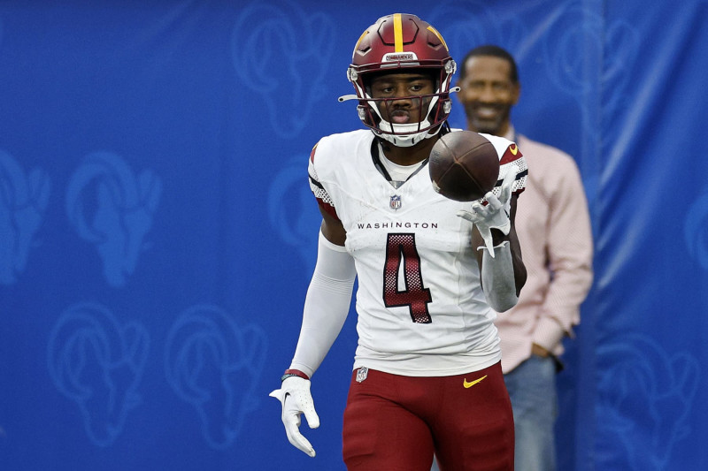 INGLEWOOD, CALIFORNIA - DECEMBER 17: Curtis Samuel #4 of the Washington Commanders reacts after catching a touchdown pass during the second half of the game against the Los Angeles Rams at SoFi Stadium on December 17, 2023 in Inglewood, California. (Photo by Kevork Djansezian/Getty Images)