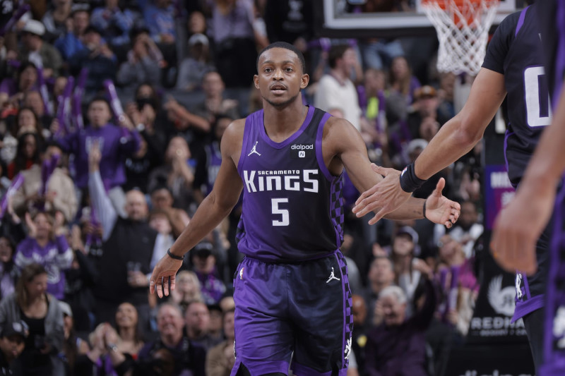 SACRAMENTO, CA - DECEMBER 23: De'Aaron Fox #5 of the Sacramento Kings high fives teammate during the game against the Minnesota Timberwolves on December 23, 2023 at Golden 1 Center in Sacramento, California. NOTE TO USER: User expressly acknowledges and agrees that, by downloading and or using this photograph, User is consenting to the terms and conditions of the Getty Images Agreement. Mandatory Copyright Notice: Copyright 2023 NBAE (Photo by Rocky Widner/NBAE via Getty Images)