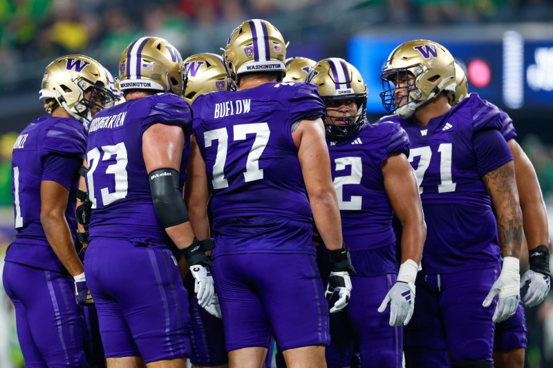 LAS VEGAS, NEVADA - DECEMBER 1: The Washington Huskies offensive unit in a group huddle during the Pac-12 Championship game against the Oregon Ducks at Allegiant Stadium on December 1, 2023 in Las Vegas, Nevada. (Photo by Brandon Sloter/Image Of Sport/Getty Images)