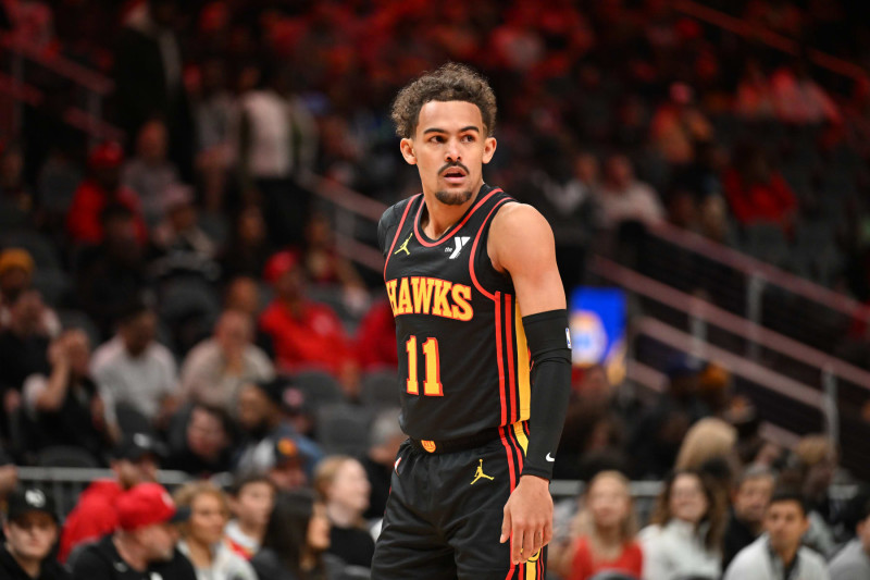 ATLANTA, GEORGIA - JANUARY 12: Trae Young #11 of the Atlanta Hawks looks on during the game against the Indiana Pacers on January 12, 2024 at State Farm Arena in Atlanta, Georgia.  NOTE TO USER: User expressly acknowledges and agrees that, by downloading and or using this photograph, User is consenting to the terms and conditions of the Getty Images License Agreement. (Photo by Paras Griffin/Getty Images)