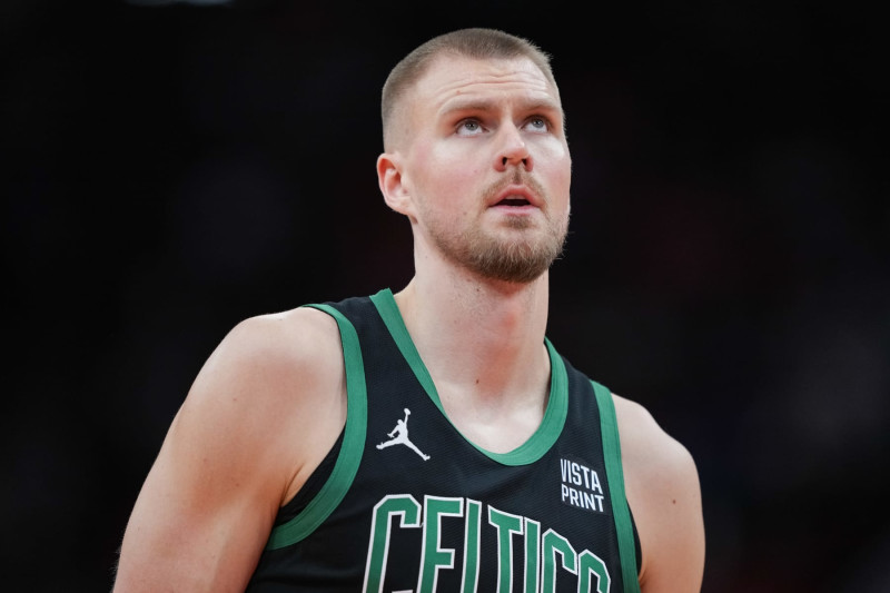 HOUSTON, TEXAS - JANUARY 21: Kristaps Porzingis #8 of the Boston Celtics looks on during the second quarter of the game against the Houston Rockets at Toyota Center on January 21, 2024 in Houston, Texas. NOTE TO USER: User expressly acknowledges and agrees that, by downloading and or using this photograph, User is consenting to the terms and conditions of the Getty Images License Agreement. (Photo by Alex Bierens de Haan/Getty Images)