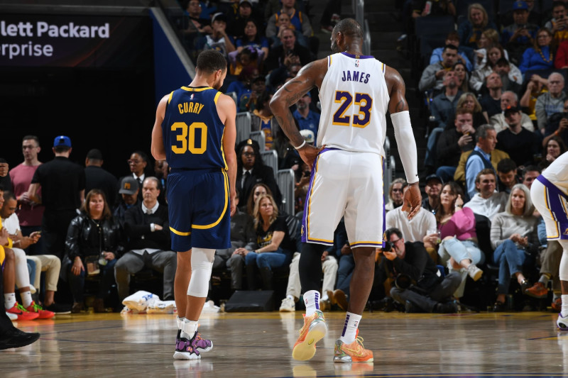 SAN FRANCISCO, CA - JANUARY 27: LeBron James #23 of the Los Angeles Lakers talks with Stephen Curry #30 of the Golden State Warriors during the game on January 27, 2024 at Chase Center in San Francisco, California. NOTE TO USER: User expressly acknowledges and agrees that, by downloading and or using this photograph, user is consenting to the terms and conditions of Getty Images License Agreement. Mandatory Copyright Notice: Copyright 2024 NBAE (Photo by Noah Graham/NBAE via Getty Images)