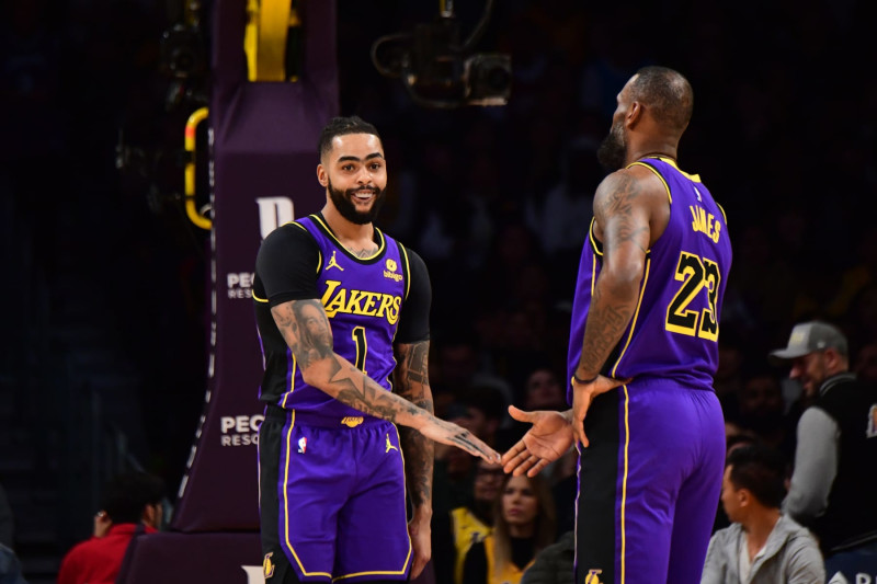 LOS ANGELES, CA - FEBRUARY 9:  D'Angelo Russell #1 and LeBron James #23 of the Los Angeles Lakers react during the game against the New Orleans Pelicans on February 9, 2024 at Crypto.Com Arena in Los Angeles, California. NOTE TO USER: User expressly acknowledges and agrees that, by downloading and/or using this Photograph, user is consenting to the terms and conditions of the Getty Images License Agreement. Mandatory Copyright Notice: Copyright 2024 NBAE (Photo by Adam Pantozzi/NBAE via Getty Images)
