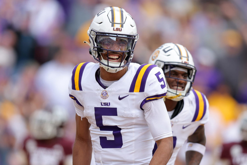 BATON ROUGE, LOUISIANA - NOVEMBER 25: Jayden Daniels #5 of the LSU Tigers celebrates a touchdown during a game against the Texas A&M Aggies at Tiger Stadium on November 25, 2023 in Baton Rouge, Louisiana. (Photo by Jonathan Bachman/Getty Images)