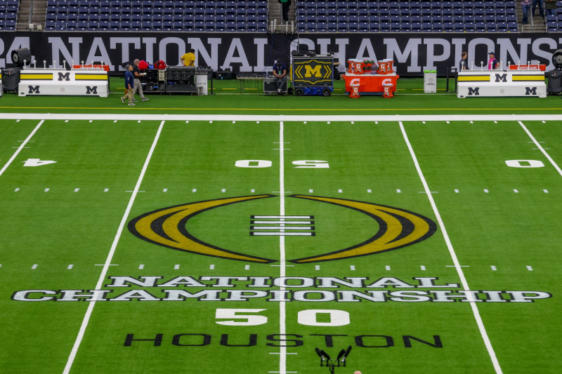 HOUSTON, TX - JANUARY 08: the CFB National Championship logo is set midfield before the College Football Playoffs National Championship game Michigan Wolverines and Washington Huskies on January 8, 2024, at NRG Stadium in Houston, Texas. (Photo by David Buono/Icon Sportswire via Getty Images)