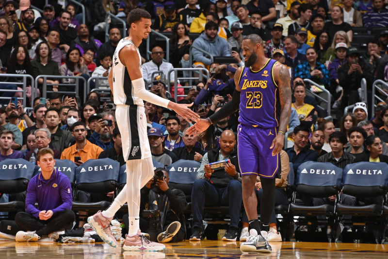 LOS ANGELES, CA - FEBRUARY 23: Victor Wembanyama #1 of the San Antonio Spurs and LeBron James #23 of the Los Angeles Lakers high five during the game on Feburary 23, 2024 at Crypto.Com Arena in Los Angeles, California. NOTE TO USER: User expressly acknowledges and agrees that, by downloading and/or using this Photograph, user is consenting to the terms and conditions of the Getty Images License Agreement. Mandatory Copyright Notice: Copyright 2024 NBAE (Photo by Andrew D. Bernstein/NBAE via Getty Images)