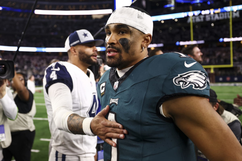 ARLINGTON, TX - DECEMBER 10: Jalen Hurts #1 of the Philadelphia Eagles walks away after talking with Dak Prescott #4 of the Dallas Cowboys after an NFL football game at AT&T Stadium on December 10, 2023 in Arlington, Texas. (Photo by Kevin Sabitus/Getty Images)