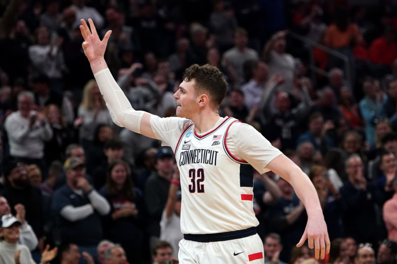 Boston, MA - March 30: UConn center Donovan Clingan celebrates after guard Cam Spencer, not pictured, drained a 3-pointer during the second half. UConn beat Illinois at TD Garden in the NCAA East Regional Final. (Photo by Barry Chin/The Boston Globe via Getty Images)