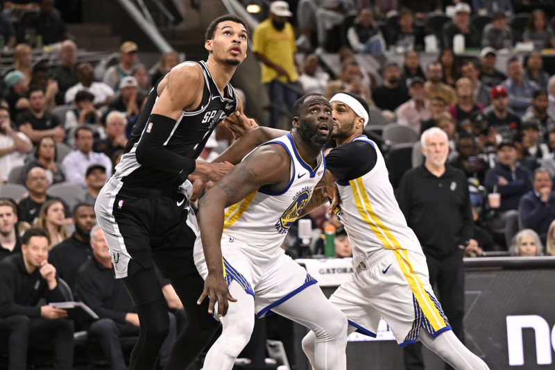 SAN ANTONIO, TX - MARCH 11: Victor Wembanyama #1 of the San Antonio Spurs and Draymond Green #23 of the Golden State Warriors looks on during the game on March 11, 2024 at the AT&T Center in San Antonio, Texas. NOTE TO USER: User expressly acknowledges and agrees that, by downloading and or using this photograph, user is consenting to the terms and conditions of the Getty Images License Agreement. Mandatory Copyright Notice: Copyright 2024 NBAE (Photos by David Dow/NBAE via Getty Images)