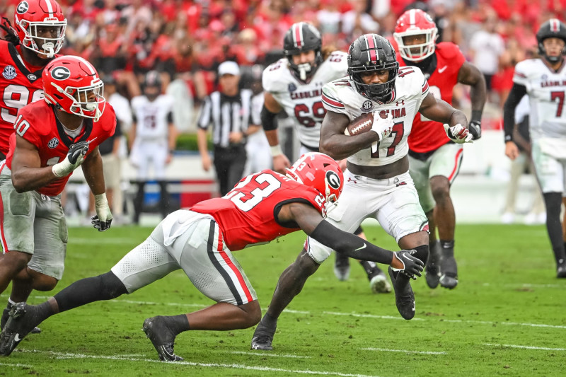 ATHENS, GA - SEPTEMBER 16: Georgia Bulldogs defensive back Tykee Smith (23) attempts to tackle South Carolina Gamecocks wide receiver Xavier Legette (17) the college football game between the South Carolina Gamecocks and Georgia Bulldogs on September 16, 2023, at Sanford Stadium in Athens, GA. (Photo by John Adams/Icon Sportswire via Getty Images)