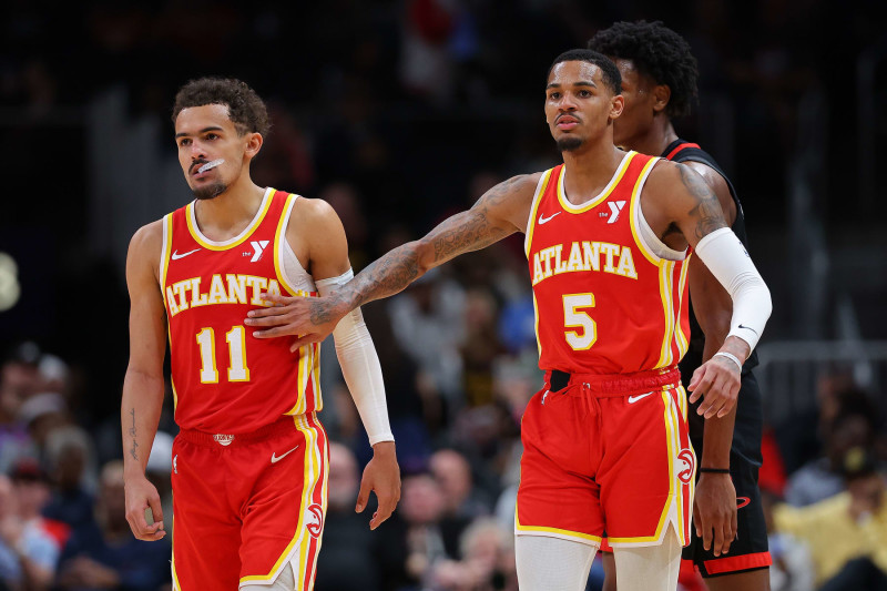 ATLANTA, GEORGIA - FEBRUARY 10:  Trae Young #11 and Dejounte Murray #5 of the Atlanta Hawks react against the Houston Rockets during the fourth quarter at State Farm Arena on February 10, 2024 in Atlanta, Georgia.  NOTE TO USER: User expressly acknowledges and agrees that, by downloading and/or using this photograph, user is consenting to the terms and conditions of the Getty Images License Agreement.  (Photo by Kevin C. Cox/Getty Images)