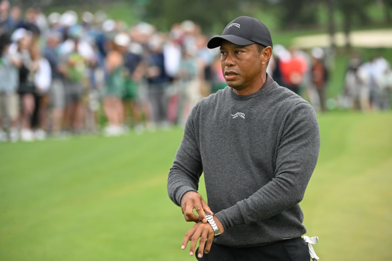 AUGUSTA, GEORGIA - APRIL 09: Tiger Woods puts on his watch prior to Masters Tournament at Augusta National Golf Club on April 9, 2024 in AUGUSTA, Georgia. (Photo by Ben Jared/PGA TOUR via Getty Images)