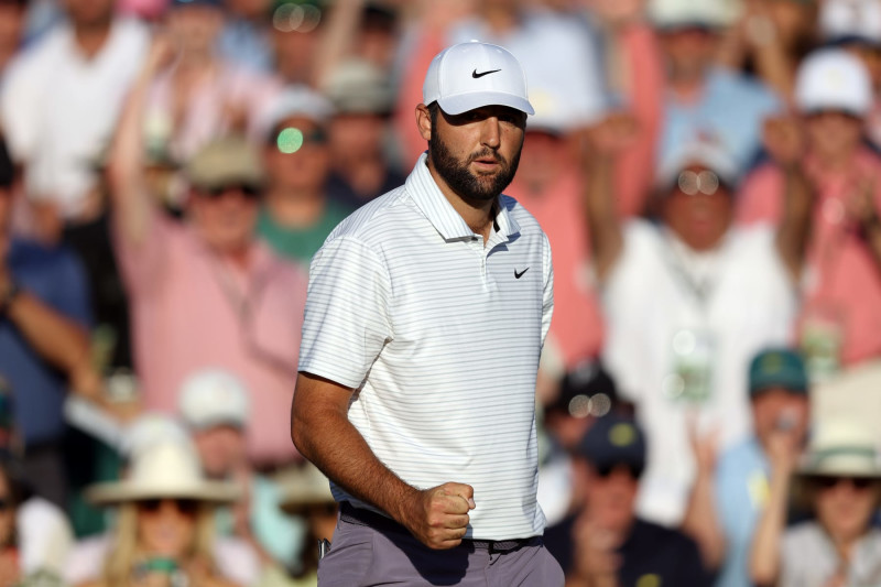 AUGUSTA, GEORGIA - APRIL 13: Scottie Scheffler of the United States reacts after making birdie on the 18th green during the third round of the 2024 Masters Tournament at Augusta National Golf Club on April 13, 2024 in Augusta, Georgia. (Photo by Warren Little/Getty Images)