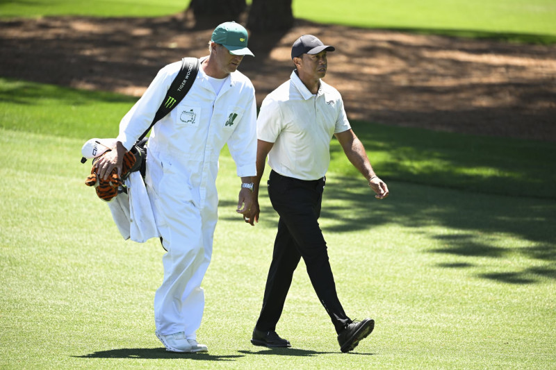 AUGUSTA, GEORGIA - APRIL 13: Tiger Woods with his caddie, Lance Bennett, on the third hole during the third round of  Masters Tournament at Augusta National Golf Club on April 13, 2024 in Augusta, Georgia. (Photo by Ben Jared/PGA TOUR via Getty Images)