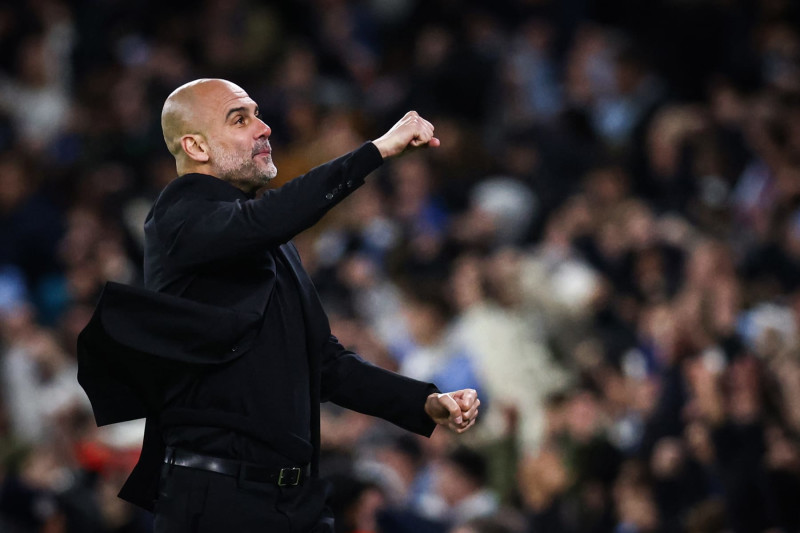 Manchester City's Spanish manager Pep Guardiola celebrates following his team first goal scored by Manchester City's Belgian midfielder #17 Kevin De Bruyne during the UEFA Champions League quarter-final second-leg football match between Manchester City and Real Madrid, at the Etihad Stadium, in Manchester, north-west England, on April 17, 2024. (Photo by Darren Staples / AFP) (Photo by DARREN STAPLES/AFP via Getty Images)