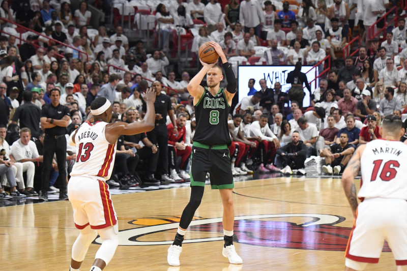 MIAMI, FL - APRIL 29:  Kristaps Porzingis #8 of the Boston Celtics shoots a 3-point basket during the game  against the Miami Heat  during Round 1 Game 4 of the 2024 NBA Playoffs on April 29, 2024 at Kaseya Center in Miami, Florida. NOTE TO USER: User expressly acknowledges and agrees that, by downloading and or using this Photograph, user is consenting to the terms and conditions of the Getty Images License Agreement. Mandatory Copyright Notice: Copyright 2024 NBAE (Photo by Brian Babineau/NBAE via Getty Images)