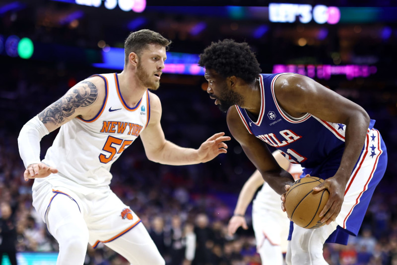 PHILADELPHIA, PENNSYLVANIA - MAY 02: Isaiah Hartenstein #55 of the New York Knicks guards Joel Embiid #21 of the Philadelphia 76ers during the second quarter of game six of the Eastern Conference First Round Playoffs at the Wells Fargo Center on May 02, 2024 in Philadelphia, Pennsylvania. (Photo by Tim Nwachukwu/Getty Images)