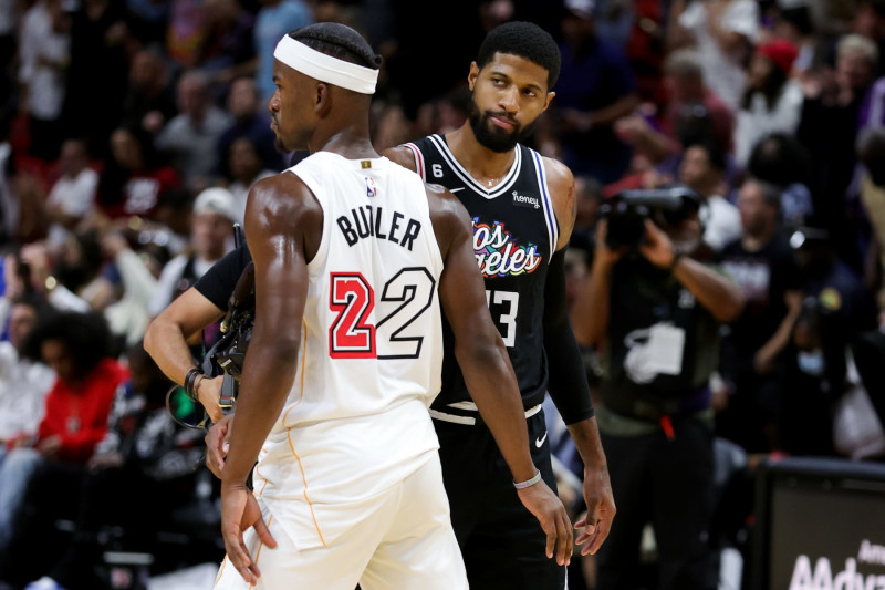 MIAMI, FLORIDA - DECEMBER 08: Jimmy Butler #22 of the Miami Heat and Paul George #13 of the LA Clippers meet on the court after their game at FTX Arena on December 08, 2022 in Miami, Florida. NOTE TO USER: User expressly acknowledges and agrees that, by downloading and or using this photograph, User is consenting to the terms and conditions of the Getty Images License Agreement. (Photo by Megan Briggs/Getty Images)