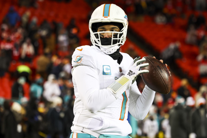 KANSAS CITY, MISSOURI - JANUARY 13: Tua Tagovailoa #1 of the Miami Dolphins warms up prior to an NFL wild-card playoff football game against the Kansas City Chiefs at GEHA Field at Arrowhead Stadium on January 13, 2024 in Kansas City, Missouri. (Photo by Kara Durrette/Getty Images)