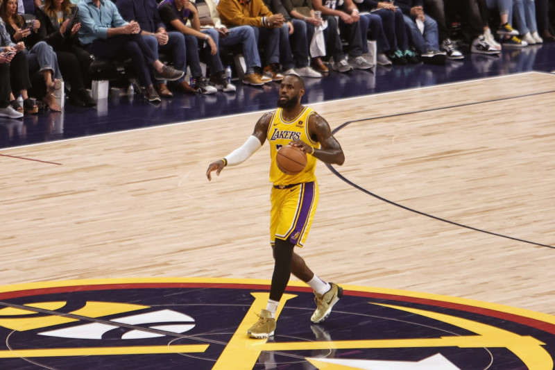 DENVER, CO - APRIL 29: LeBron James #23 of the Los Angeles Lakers brings the ball up court during the game against the Denver Nuggets during Round 1 Game 5 on April 29, 2024 at Ball Arena in Denver, Colorado. NOTE TO USER: User expressly acknowledges and agrees that, by downloading and/or using this Photograph, user is consenting to the terms and conditions of the Getty Images License Agreement. Mandatory Copyright Notice: Copyright 2024 NBAE (Photo by Jim Poorten/NBAE via Getty Images)