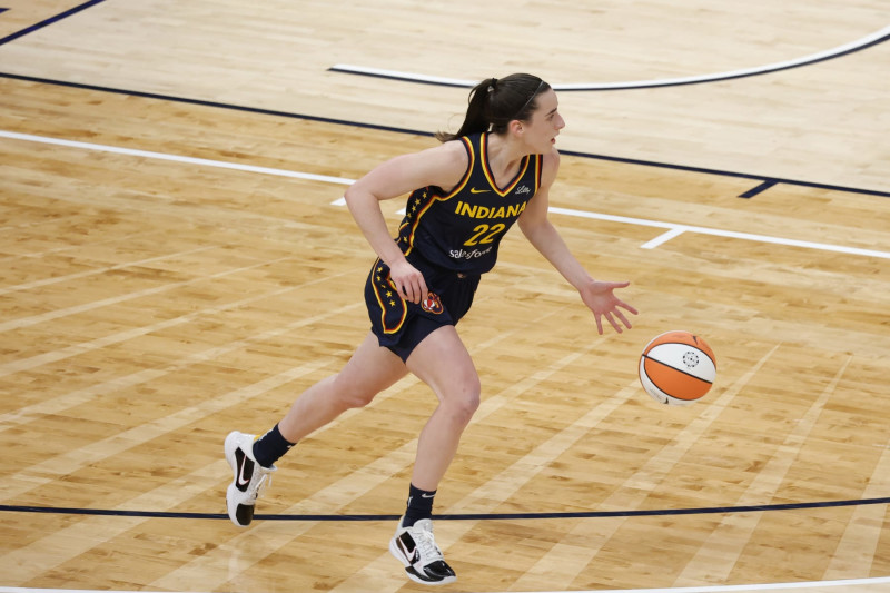 INDIANAPOLIS, IN - MAY 09: Indiana Fever guard Caitlin Clark (22) brings the ball up court against the Atlanta Dream during a WNBA preseason game on May 9, 2024, at Gainbridge Fieldhouse in Indianapolis, Indiana. (Photo by Brian Spurlock/Icon Sportswire via Getty Images)