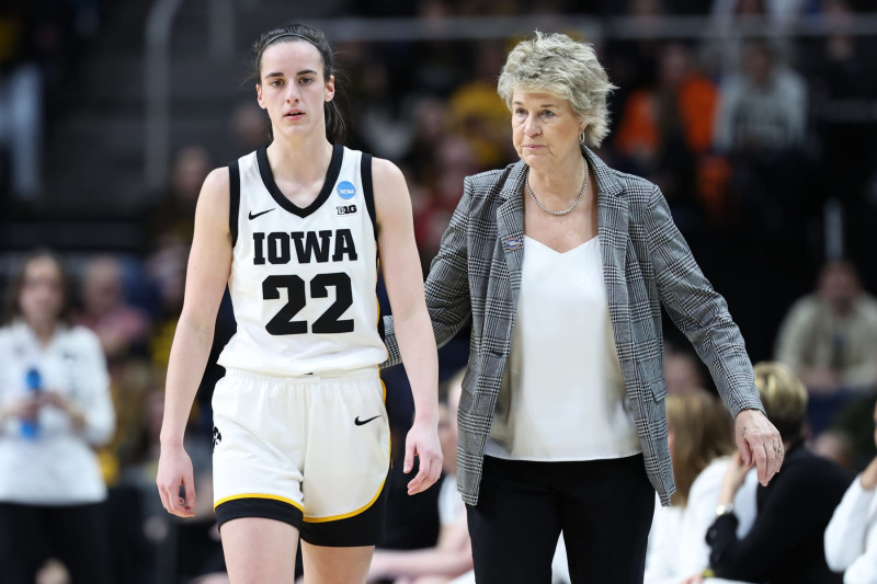 ALBANY, NEW YORK - MARCH 30: Caitlin Clark #22 of the Iowa Hawkeyes walks with head coach Lisa Bluder of the Iowa Hawkeyes during a game against the Colorado Buffaloes during the Sweet Sixteen round of the 2024 NCAA Women's Basketball Tournament held at MVP Arena on March 30, 2024 in Albany, New York. (Photo by Scott Taetsch/NCAA Photos via Getty Images)