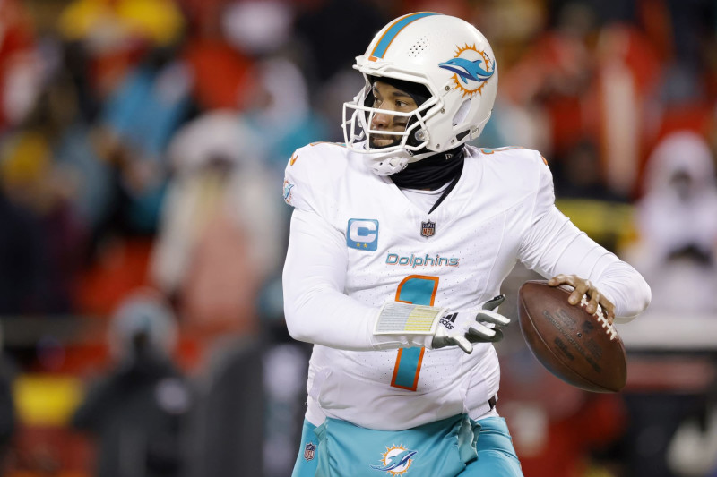 KANSAS CITY, MISSOURI - JANUARY 13: Tua Tagovailoa #1 of the Miami Dolphins looks to pass during the first half against the Kansas City Chiefs in the AFC Wild Card Playoffs at GEHA Field at Arrowhead Stadium on January 13, 2024 in Kansas City, Missouri. (Photo by David Eulitt/Getty Images)