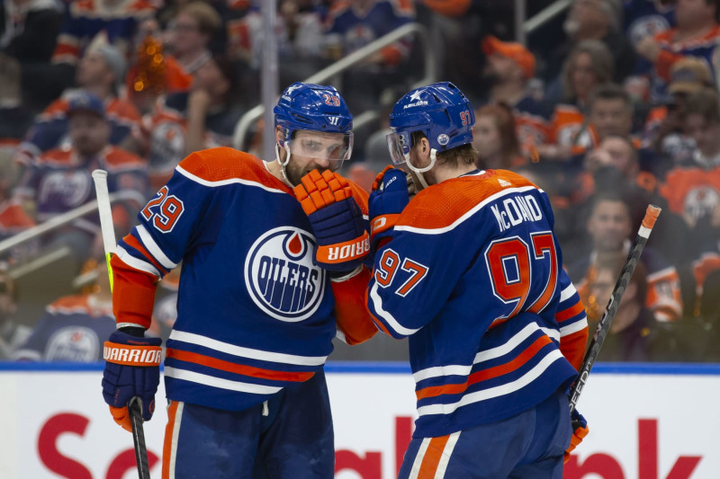 EDMONTON, CANADA - APRIL 22: Leon Draisaitl #29 and Connor McDavid #97 of the Edmonton Oilers strategize against the Los Angeles Kings during the second period in Game One of the First Round of the 2024 Stanley Cup Playoffs at Rogers Place on April 22, 2024, in Edmonton, Canada.  (Photo by Codie McLachlan/Getty Images)