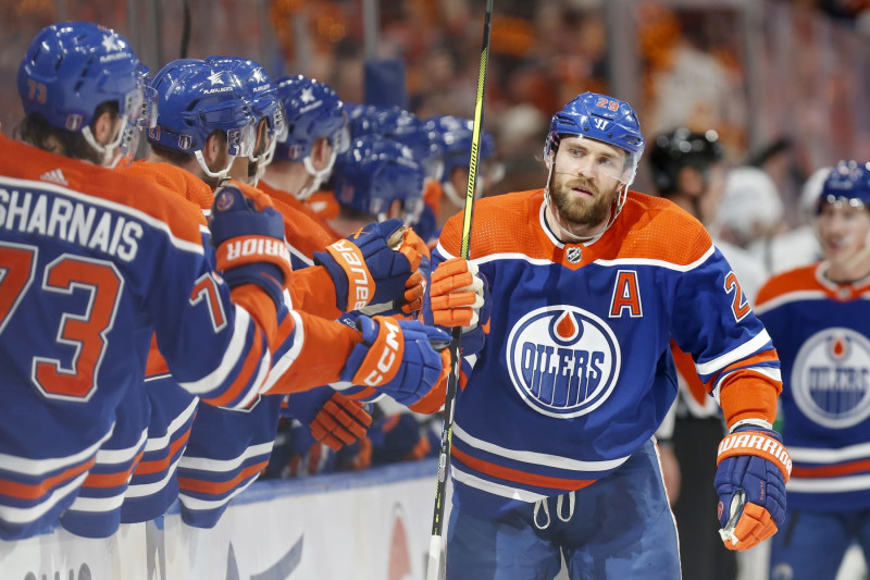 EDMONTON, ALBERTA - MAY 14: Leon Draisaitl #29 of the Edmonton Oilers celebrates with teammates after a goal during the first period against the Vancouver Canucks in Game Four of the Second Round of the 2024 Stanley Cup Playoffs at Rogers Place on May 14, 2024 in Edmonton, Alberta.  (Photo by Codie McLachlan/Getty Images)