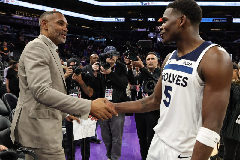 PHOENIX, AZ - APRIL 28: Anthony Edwards #5 of the Minnesota Timberwolves embraces Grant Hill after the game against the Phoenix Suns during Round 1 Game 4 on April 28, 2024 at the Footprint Center in Phoenix, Arizona. NOTE TO USER: User expressly acknowledges and agrees that, by downloading and/or using this Photograph, user is consenting to the terms and conditions of the Getty Images License Agreement. Mandatory Copyright Notice: Copyright 2024 NBAE (Photo by Jim Poorten/NBAE via Getty Images)