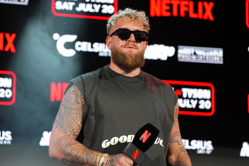 ARLINGTON, TEXAS - MAY 16: Jake Paul speaks onstage during the Jake Paul vs. Mike Tyson Boxing match Arlington press conference at Texas Live! on May 16, 2024 in Arlington, Texas.  (Photo by Cooper Neill/Getty Images for Netflix)