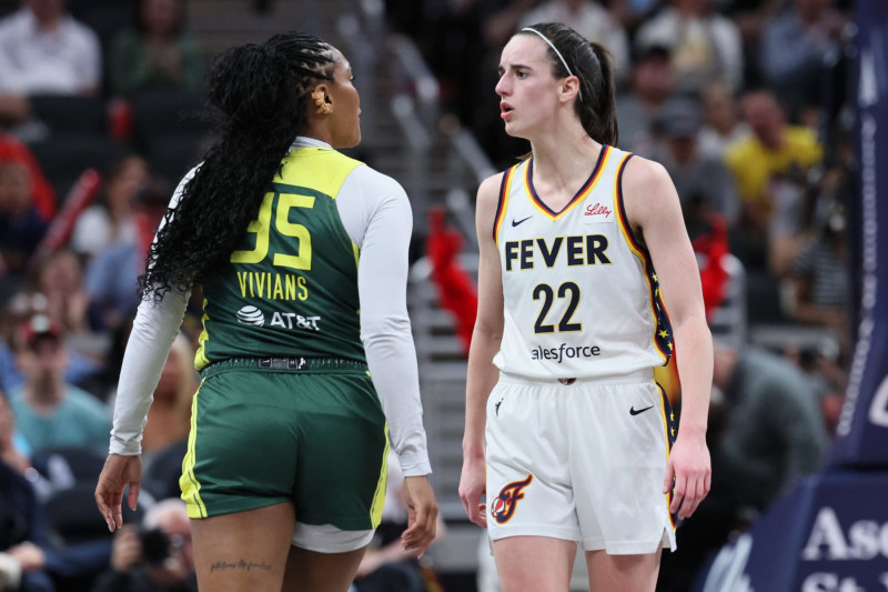 INDIANAPOLIS, INDIANA - MAY 30: Caitlin Clark #22 of the Indiana Fever exchanges words with Victoria Vivians #35 of the Seattle Storm during the first quarter in the game at Gainbridge Fieldhouse on May 30, 2024 in Indianapolis, Indiana. NOTE TO USER: User expressly acknowledges and agrees that, by downloading and or using this photograph, User is consenting to the terms and conditions of the Getty Images License Agreement. (Photo by Andy Lyons/Getty Images)