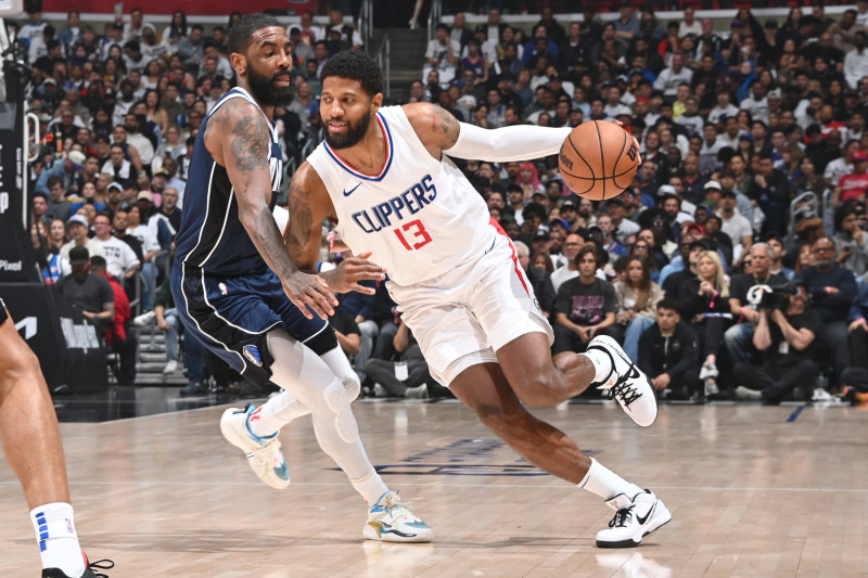 LOS ANGELES, CA - MAY 1: Paul George #13 of the LA Clippers handles the ball during the game against the Dallas Mavericks during Round 1 Game 5 of the 2024 NBA Playoffs  on May 1, 2024 at Crypto.Com Arena in Los Angeles, California. NOTE TO USER: User expressly acknowledges and agrees that, by downloading and/or using this Photograph, user is consenting to the terms and conditions of the Getty Images License Agreement. Mandatory Copyright Notice: Copyright 2024 NBAE (Photo by Andrew D. Bernstein/NBAE via Getty Images)