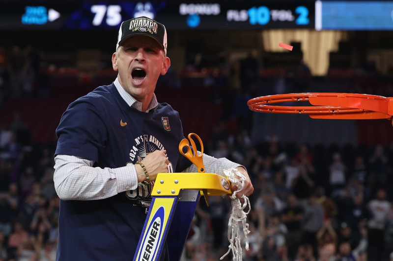 GLENDALE, ARIZONA - APRIL 08: Head coach Dan Hurley of the Connecticut Huskies cuts down the net after beating the Purdue Boilermakers 75-60 to win the NCAA Men's Basketball Tournament National Championship game at State Farm Stadium on April 08, 2024 in Glendale, Arizona. (Photo by Christian Petersen/Getty Images)