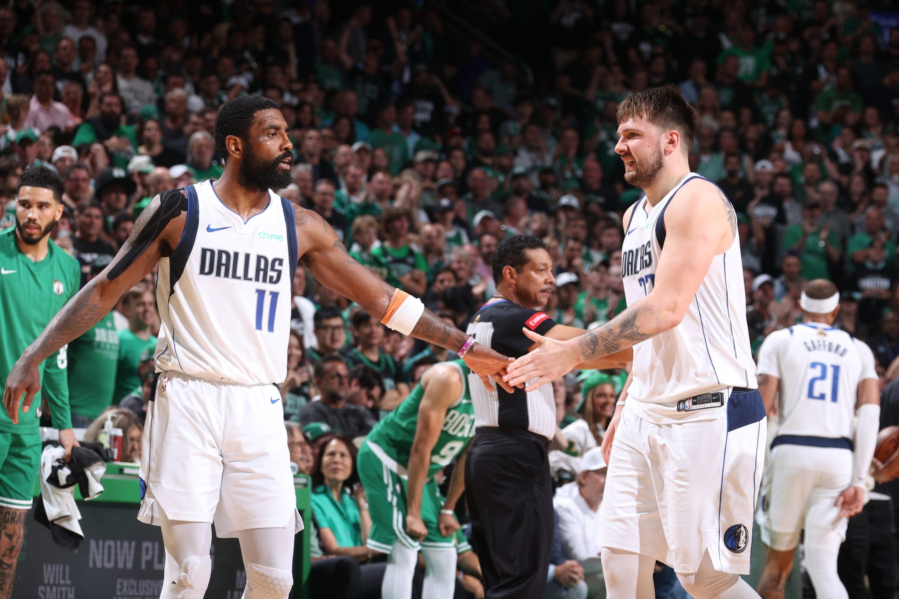 BOSTON, MA - JUNE 17: Kyrie Irving #11 high five Luka Doncic #77 of the Dallas Mavericks during the game against the Boston Celtics during Game 5 of the 2024 NBA Finals on June 17, 2024 at the TD Garden in Boston, Massachusetts. NOTE TO USER: User expressly acknowledges and agrees that, by downloading and or using this photograph, User is consenting to the terms and conditions of the Getty Images License Agreement. Mandatory Copyright Notice: Copyright 2024 NBAE (Photo by Nathaniel S. Butler/NBAE via Getty Images)