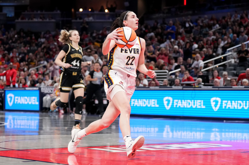 INDIANAPOLIS, INDIANA - JUNE 19: Caitlin Clark #22 of the Indiana Fever drives to the basket during the first half of a game against the Washington Mystics at Gainbridge Fieldhouse on June 19, 2024 in Indianapolis, Indiana. NOTE TO USER: User expressly acknowledges and agrees that, by downloading and or using this photograph, User is consenting to the terms and conditions of the Getty Images License Agreement. (Photo by Emilee Chinn/Getty Images)