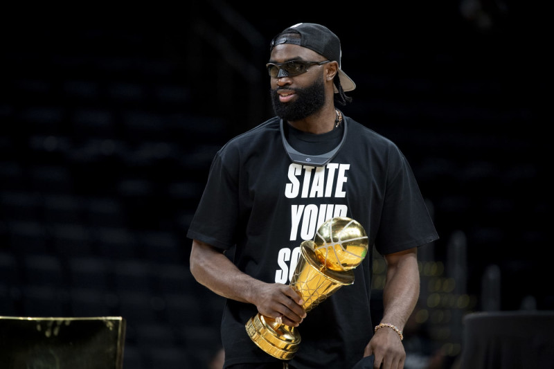 BOSTON, MASSACHUSETTS - JUNE 21: Jaylen Brown #7 of the Boston Celtics is introduced holding the MVP trophy during the Boston Celtics Victory Event following their 2024 NBA Finals win at TD Garden on June 21, 2024 in Boston, Massachusetts. (Photo by Maddie Malhotra/Getty Images)