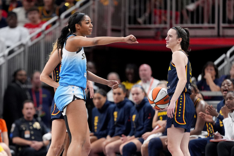 INDIANAPOLIS, INDIANA - JUNE 16: Angel Reese #5 of the Chicago Sky reacts after fouling Caitlin Clark #22 of the Indiana Fever during the second half at Gainbridge Fieldhouse on June 16, 2024 in Indianapolis, Indiana. NOTE TO USER: User expressly acknowledges and agrees that, by downloading and or using this photograph, User is consenting to the terms and conditions of the Getty Images License Agreement. (Photo by Emilee Chinn/Getty Images)