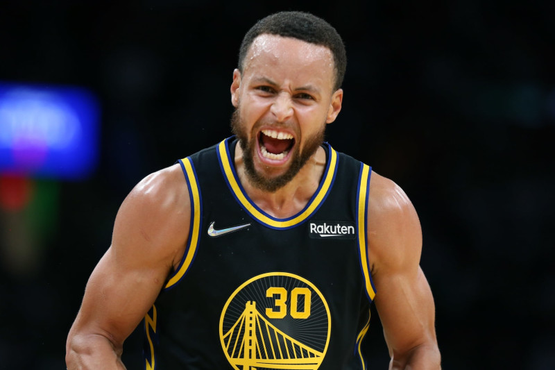 Boston - June 10: The Warriors Stephen Curry (30) howled at Celtics fans after he hit a three point shot. The Boston Celtics host The Golden State Warriors in game 4 of the NBA Finals at TD Garden in Boston on June 10, 2022. (Photo by Jim Davis/The Boston Globe via Getty Images)