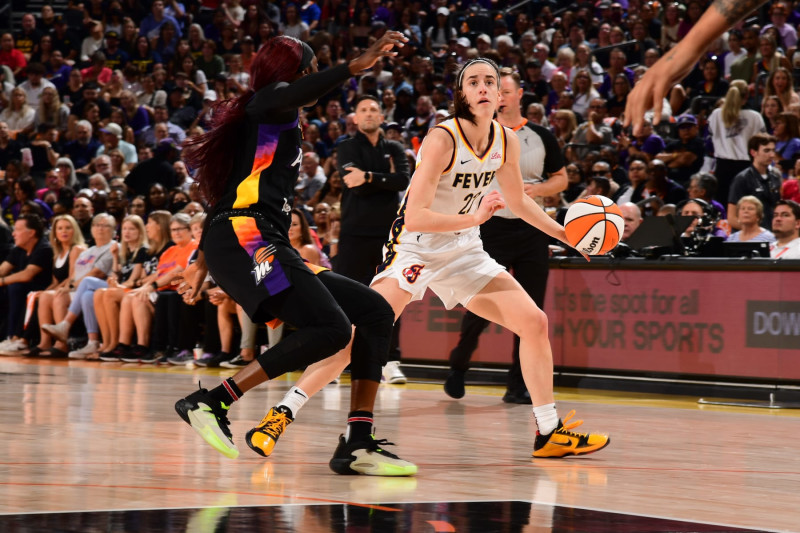 PHOENIX, AZ - JUNE 30: Caitlin Clark #22 of the Indiana Fever dribbles the ball during the game against the Phoenix Mercury on June 30, 2024 at Footprint Center in Phoenix, Arizona. NOTE TO USER: User expressly acknowledges and agrees that, by downloading and or using this photograph, user is consenting to the terms and conditions of the Getty Images License Agreement. Mandatory Copyright Notice: Copyright 2024 NBAE (Photo by Kate Frese/NBAE via Getty Images)