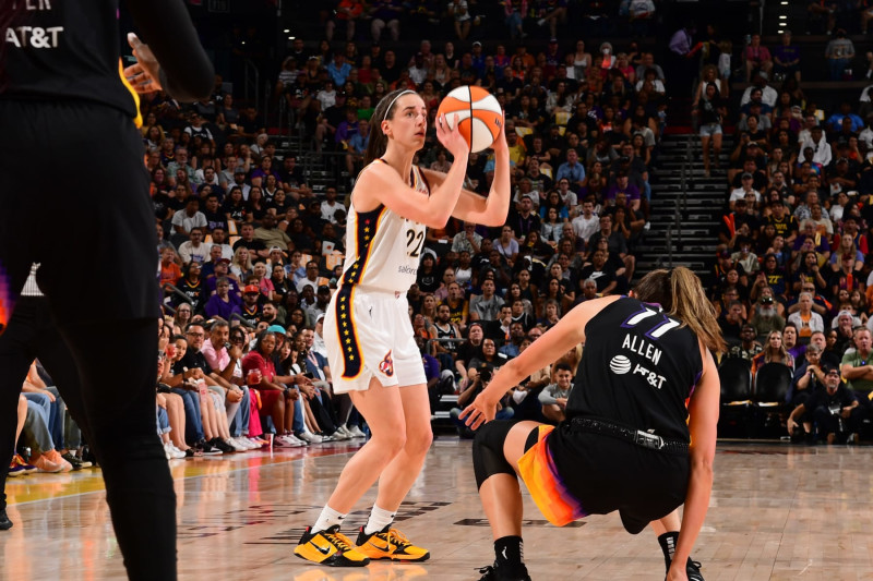 PHOENIX, AZ - JUNE 30: Caitlin Clark #22 of the Indiana Fever shoots a three point basket during the game  against the Phoenix Mercury on June 30, 2024 at Footprint Center in Phoenix, Arizona. NOTE TO USER: User expressly acknowledges and agrees that, by downloading and or using this photograph, user is consenting to the terms and conditions of the Getty Images License Agreement. Mandatory Copyright Notice: Copyright 2024 NBAE (Photo by Kate Frese/NBAE via Getty Images)