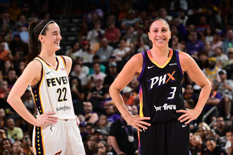 PHOENIX, AZ - JUNE 30: Caitlin Clark #22 of the Indiana Fever and Diana Taurasi #3 of the Phoenix Mercury smile during the game on June 30, 2024 at Footprint Center in Phoenix, Arizona. NOTE TO USER: User expressly acknowledges and agrees that, by downloading and or using this photograph, user is consenting to the terms and conditions of the Getty Images License Agreement. Mandatory Copyright Notice: Copyright 2024 NBAE (Photo by Kate Frese/NBAE via Getty Images)