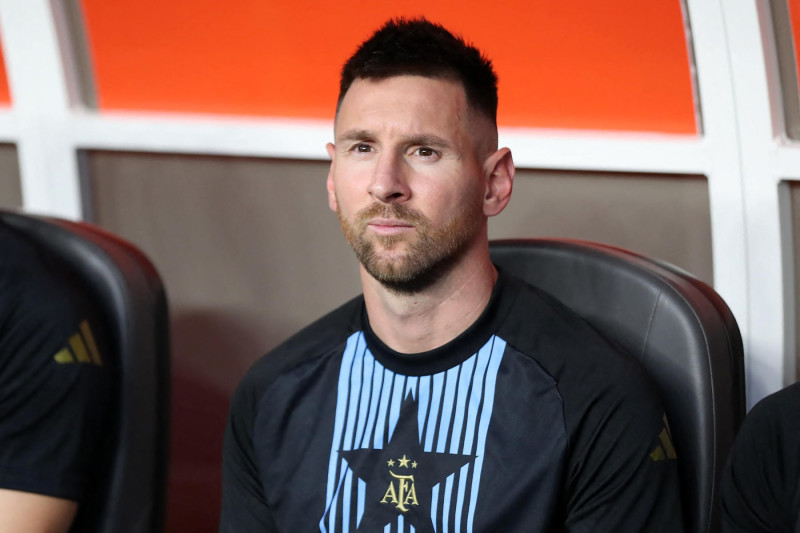 Argentina's forward #10 Lionel Messi looks on from the bench ahead of the Conmebol 2024 Copa America tournament group A football match between Argentina and Peru at Hard Rock Stadium in Miami, Florida on June 29, 2024. (Photo by Chris ARJOON / AFP) (Photo by CHRIS ARJOON/AFP via Getty Images)