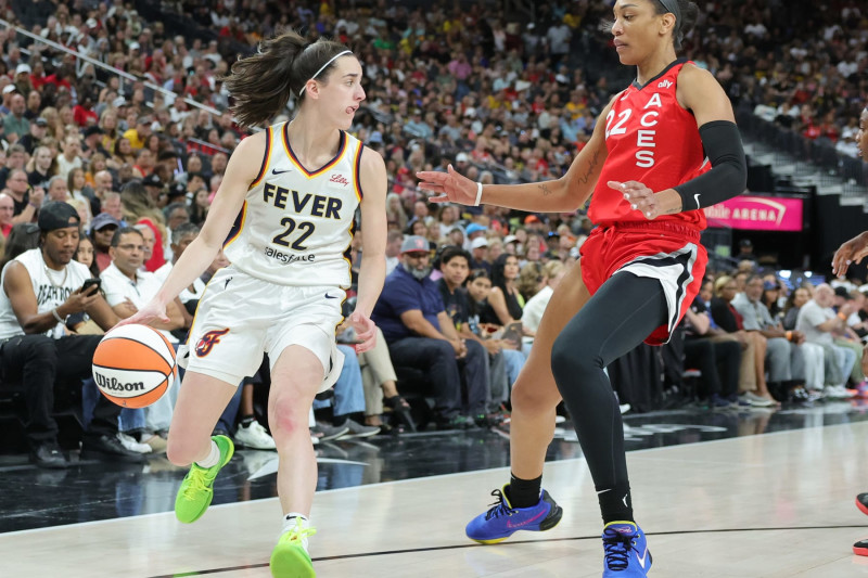 LAS VEGAS, NEVADA - JULY 02: Caitlin Clark #22 of the Indiana Fever is guarded by A'ja Wilson #22 of the Las Vegas Aces in the first quarter of their game at T-Mobile Arena on July 02, 2024 in Las Vegas, Nevada. NOTE TO USER: User expressly acknowledges and agrees that, by downloading and or using this photograph, User is consenting to the terms and conditions of the Getty Images License Agreement. (Photo by Ethan Miller/Getty Images)