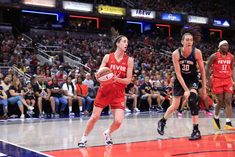 INDIANAPOLIS, IN - JULY 6: Caitlin Clark #22 of the Indiana Fever handles the ball during the game against the New York Liberty on July 6, 2024 at Gainbridge Fieldhouse in Indianapolis, Indiana. NOTE TO USER: User expressly acknowledges and agrees that, by downloading and or using this Photograph, user is consenting to the terms and conditions of the Getty Images License Agreement. Mandatory Copyright Notice: Copyright 2024 NBAE (Photo by Justin Casterline/NBAE via Getty Images)