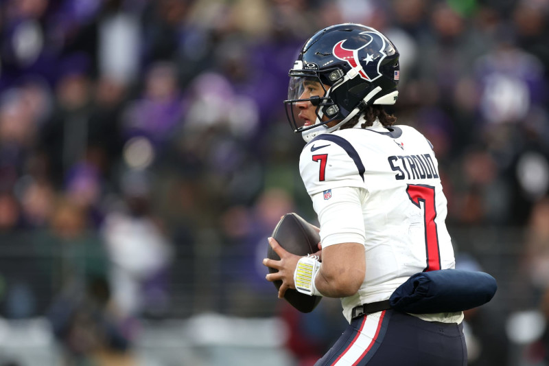 BALTIMORE, MARYLAND - JANUARY 20: Quarterback C.J. Stroud #7 of the Houston Texans looks to pass against the Baltimore Ravens during the AFC Divisional Playoff game at M&T Bank Stadium on January 20, 2024 in Baltimore, Maryland. (Photo by Rob Carr/Getty Images)