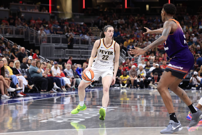 INDIANAPOLIS, IN - JULY 12: Caitlin Clark #22 of the Indiana Fever dribbles the ball during the game against the Phoenix Mercury on July 12, 2024 at Gainbridge Fieldhouse in Indianapolis, Indiana. NOTE TO USER: User expressly acknowledges and agrees that, by downloading and or using this Photograph, user is consenting to the terms and conditions of the Getty Images License Agreement. Mandatory Copyright Notice: Copyright 2024 NBAE (Photo by Justin Casterline/NBAE via Getty Images)