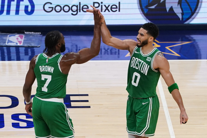 INDIANAPOLIS, INDIANA - MAY 27: (L-R) Jaylen Brown #7 of the Boston Celtics and Jayson Tatum #0 of the Boston Celtics high five during the second quarter in Game Four of the Eastern Conference Finals at Gainbridge Fieldhouse on May 27, 2024 in Indianapolis, Indiana. NOTE TO USER: User expressly acknowledges and agrees that, by downloading and or using this photograph, User is consenting to the terms and conditions of the Getty Images License Agreement. (Photo by Dylan Buell/Getty Images)