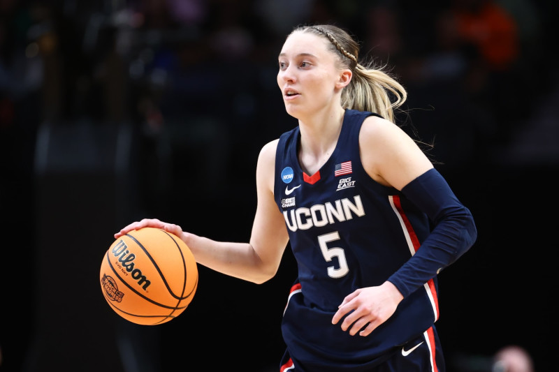 PORTLAND, OREGON - APRIL 01: Paige Bueckers #5 of the UConn Huskies dribbles the ball during the first half of the game against the USC Trojans during the Elite Eight round of the 2024 NCAA Women's Basketball Tournament held at the Moda Center on April 1, 2024 in Portland, Oregon. (Photo by Tyler Schank/NCAA Photos via Getty Images)